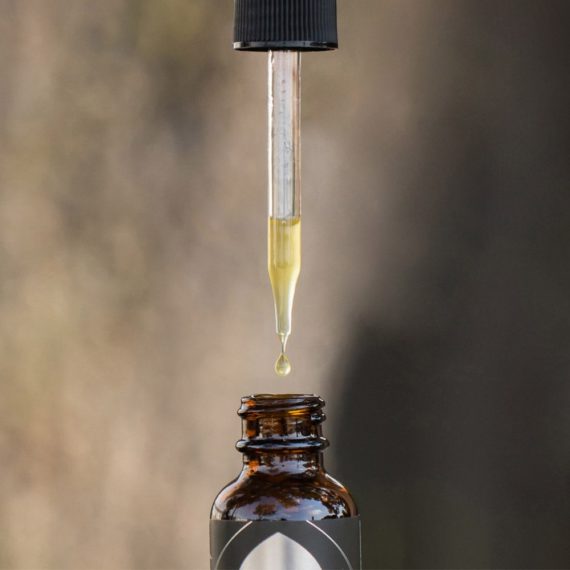 cbd oil tincture dropping into bottle