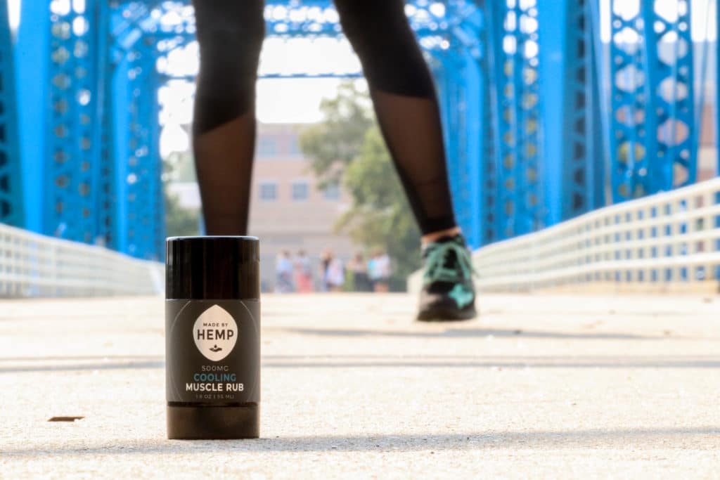 Made By Hemp Cooling Muscle Rub on the Grand Rapids Blue Bridge with a runner